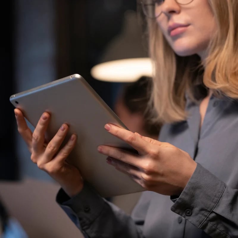 hr dashboard female employee holding tablet