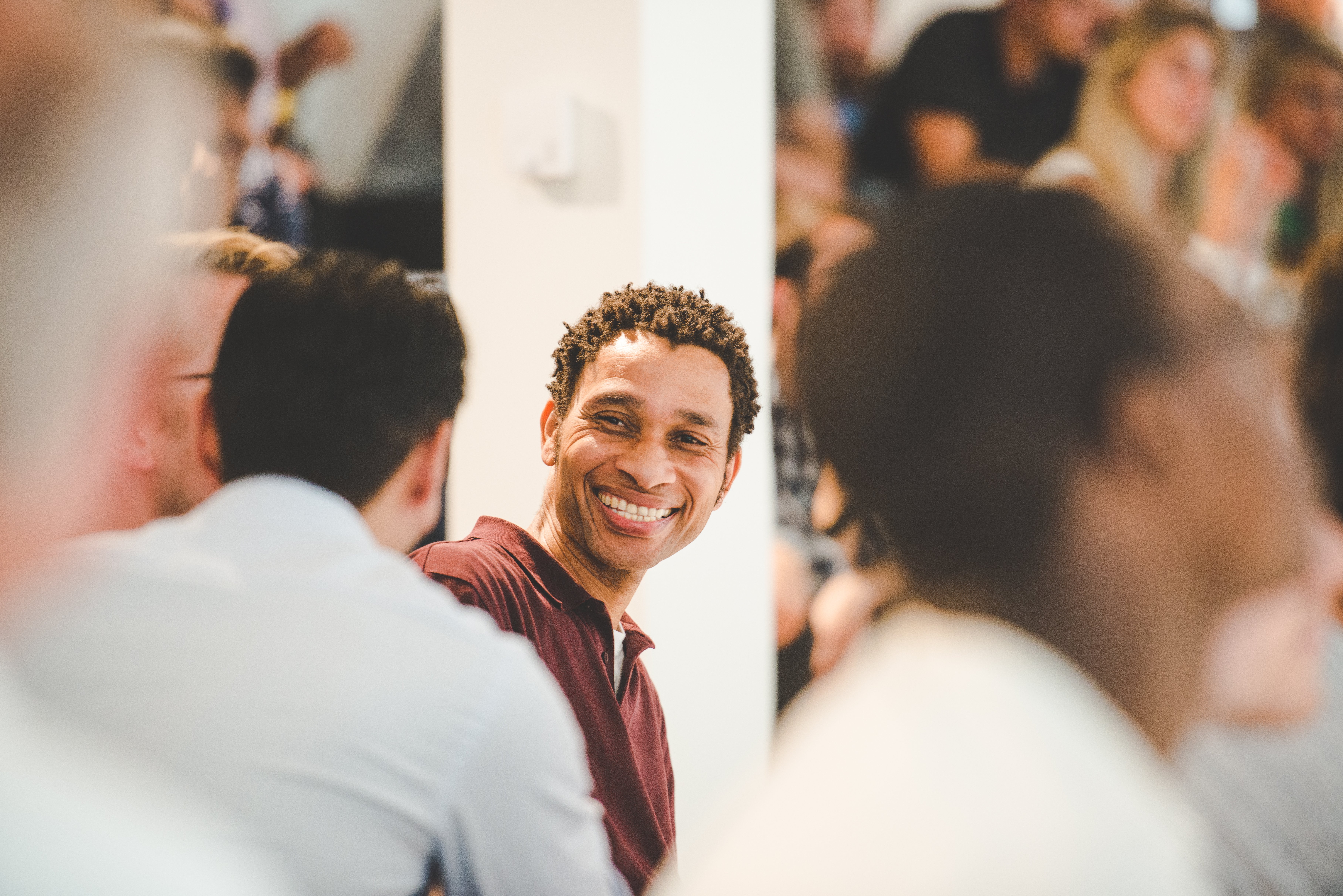 We are all responsible for the company growth. The picture is from one of our Summer Events. It shows one of our colleagues smiling and interacting with other team members.